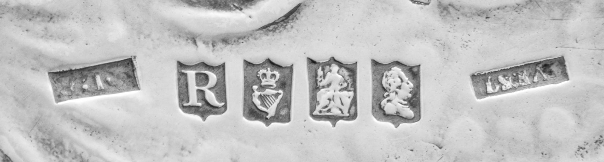 An Irish George III Silver Salver, Jas. Le Bass for Alderman West, Dublin, 1813, the undulating border worked to show rocaille, S-scrol