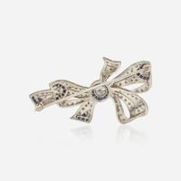 An Art Deco Platinum, Diamond, and Sapphire Brooch