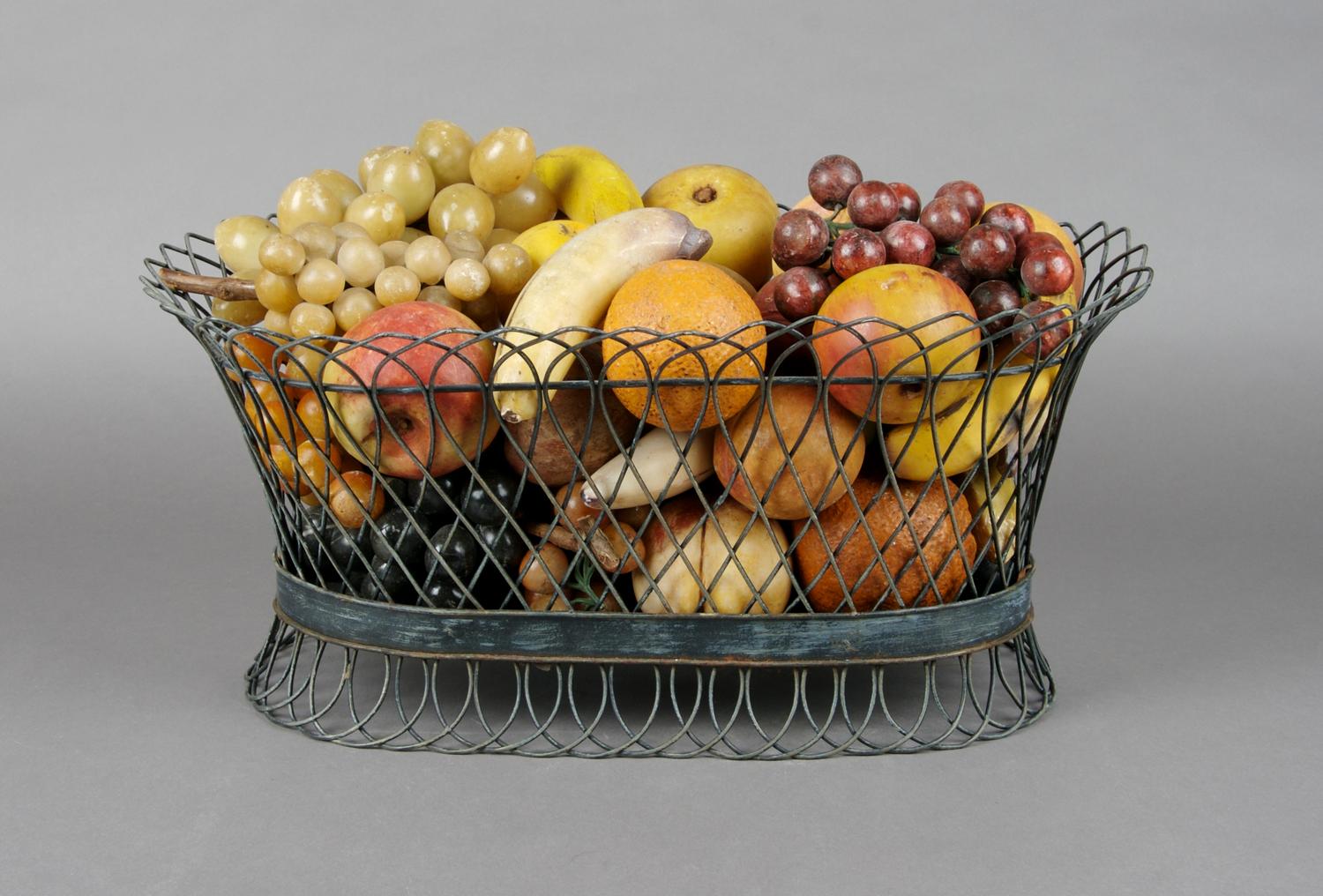 A Collection of Painted Stone Fruit, Height of basket 8 1/4 x width 18 inches.