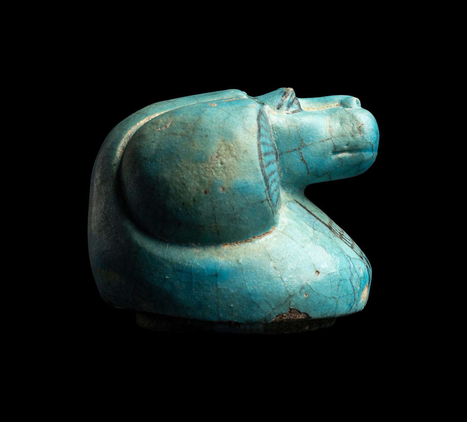 An Egyptian Blue Faience Canopic Jar Lid with the Head of a Baboon (Hapi)