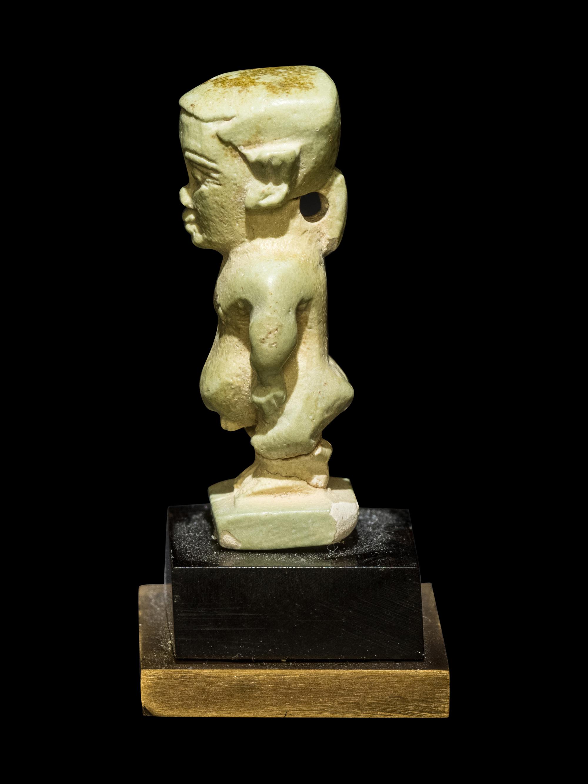 Three Egyptian Faience Amulets Including a Pataikos, a Harpocrates, and a Recumbent Lion