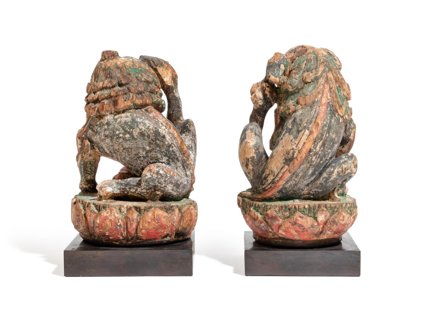 A Pair of Chinese Polychrome Painted Wood Figures of Fu Lions