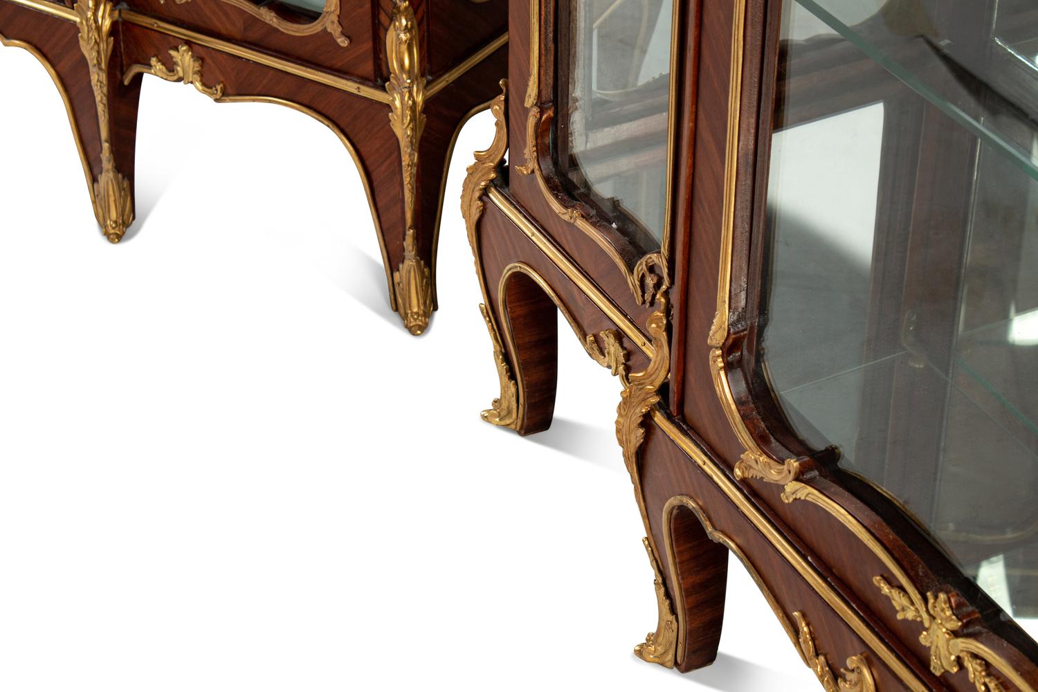 A Pair of Louis XV Style Gilt Bronze Mounted Kingwood and Rosewood Marble-Top Vitrine Cabinets