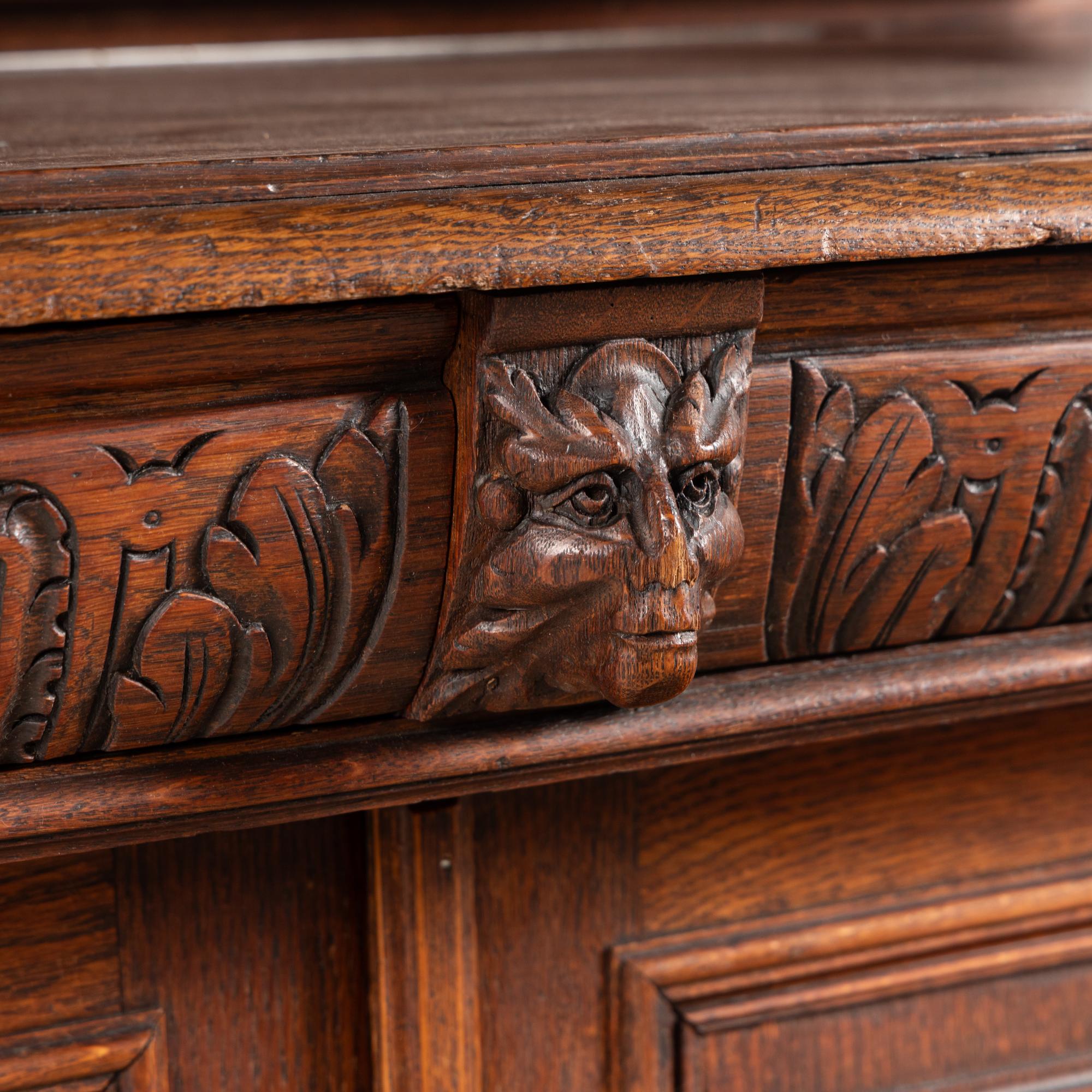 A French Neoclassical Carved Walnut Serving Cabinet