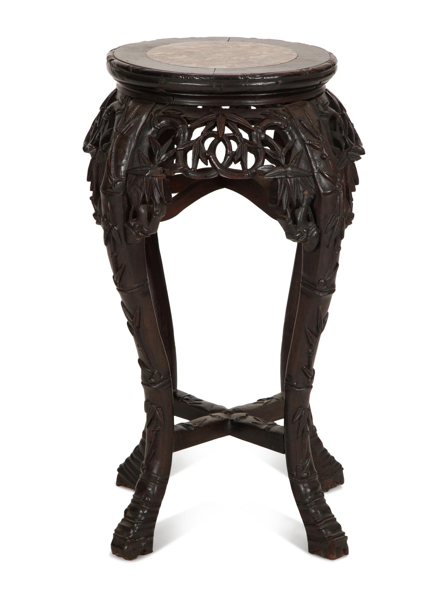 A Chinese Carved Hardwood Stand with Inset Marble Top