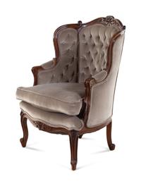A Louis XV Style Carved Walnut Bergère