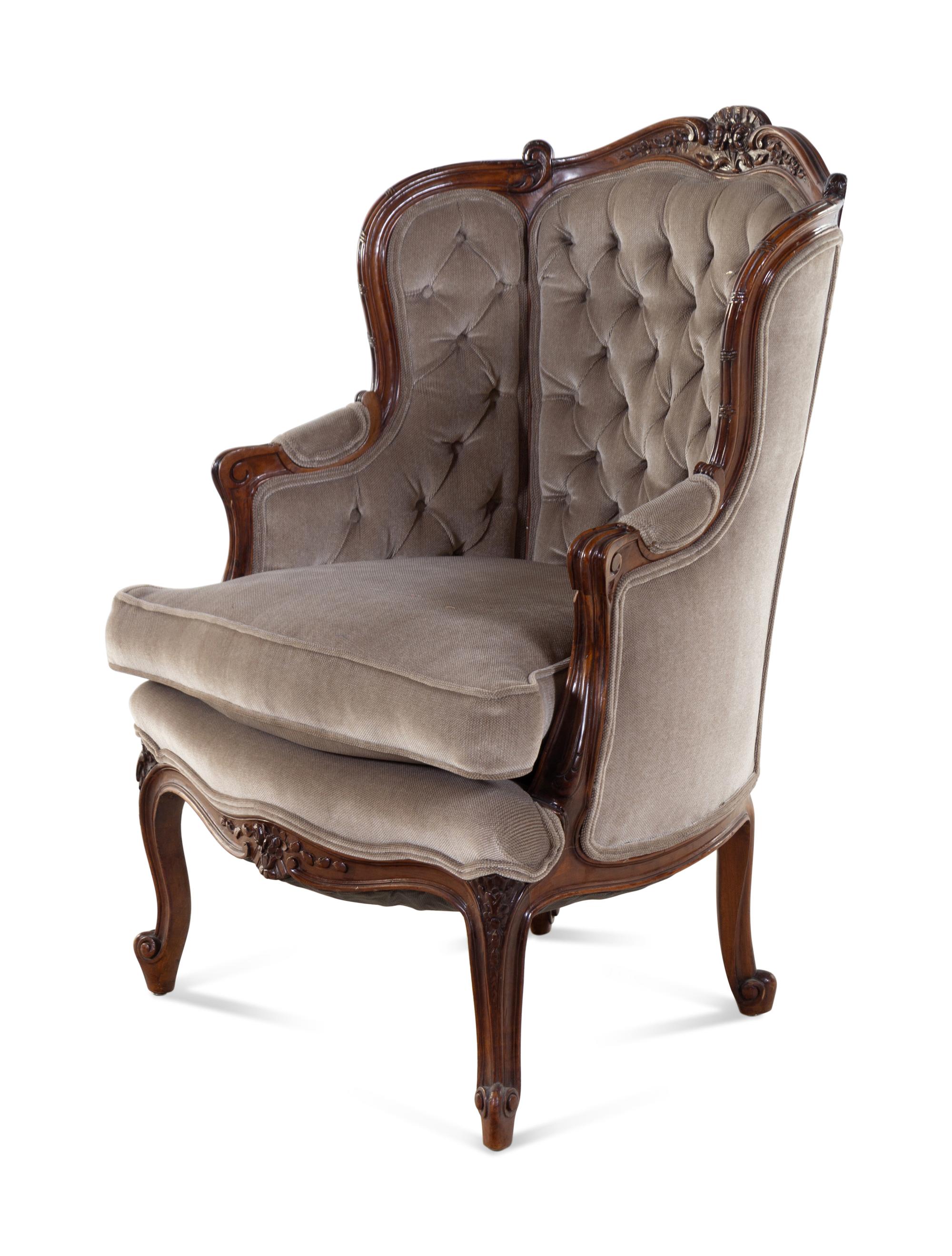 A Louis XV Style Carved Walnut Bergère