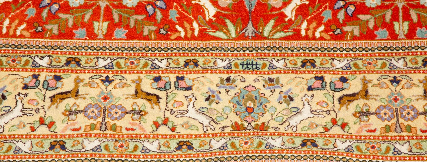 A Tabriz Hunting Design Border Wool Rug