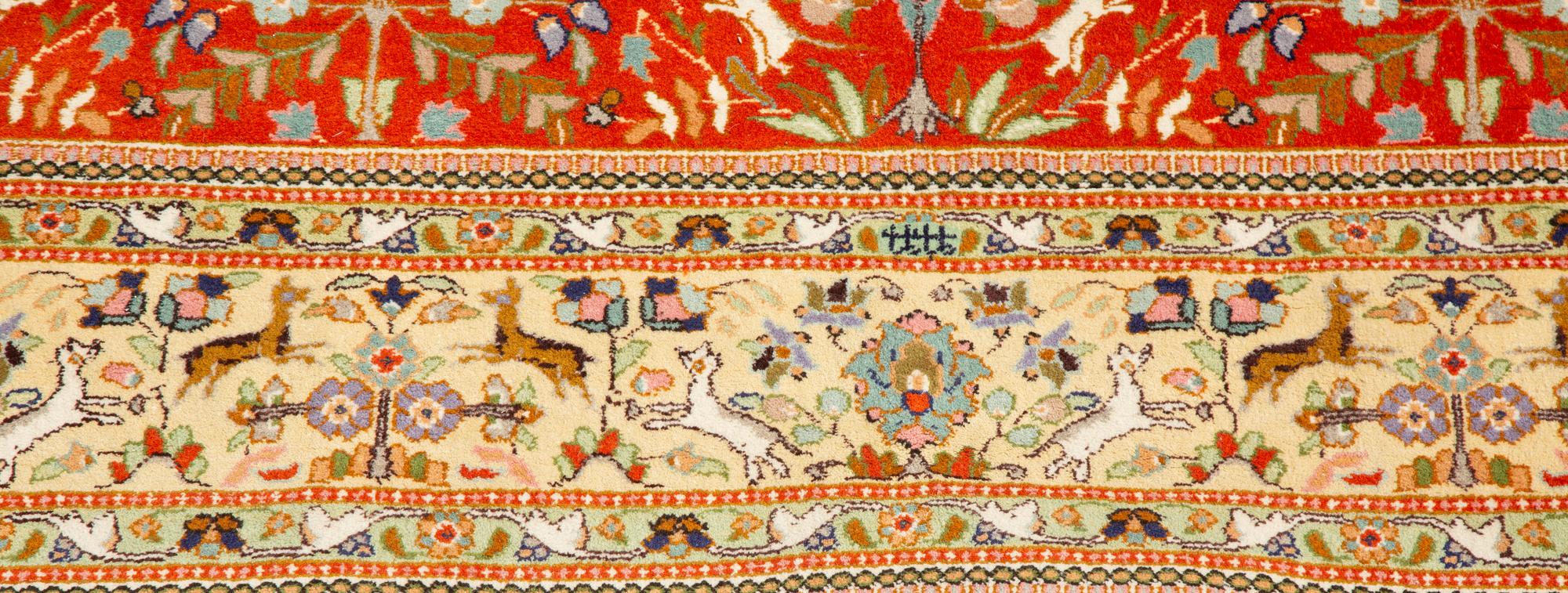 A Tabriz Hunting Design Border Wool Rug