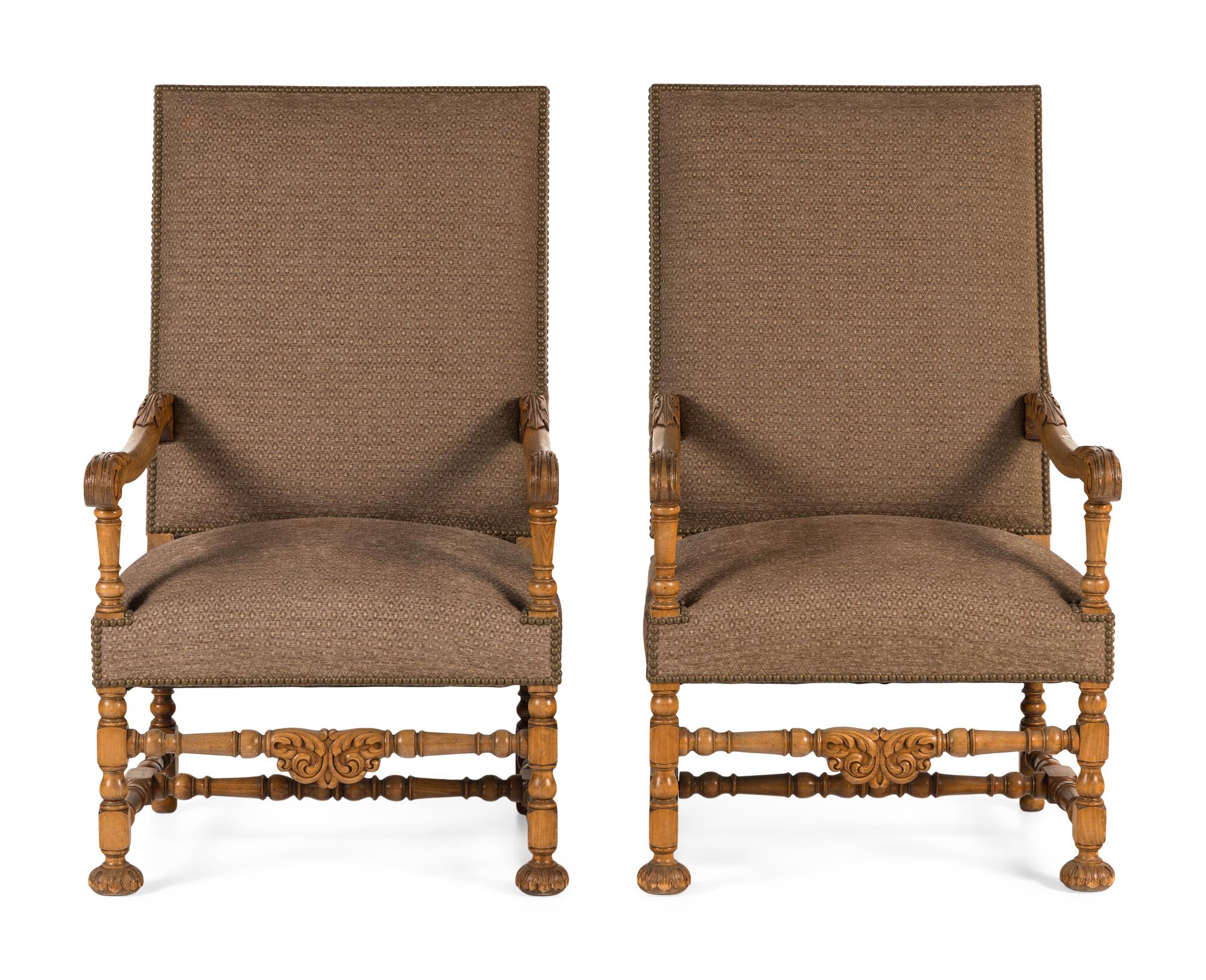 A Pair of Continental Baroque Style Carved Walnut Armchairs