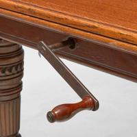 An English Aesthetic Movement carved oak dining table and set of twelve dining chairs Lamb of Manchester, Manchester, England, circa 1875