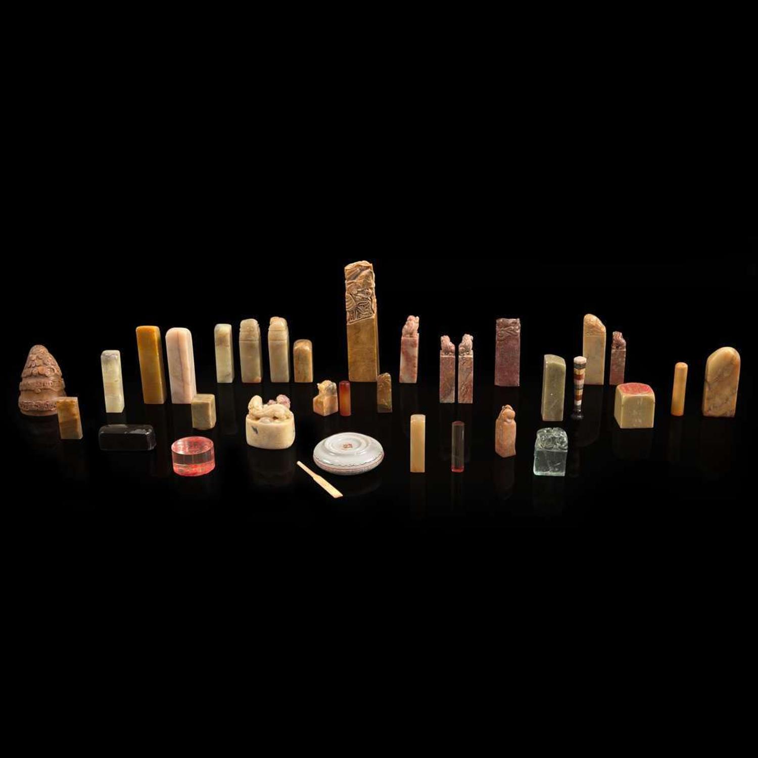 A group of 31 seals, a seal paste box, and two notebooks of seal impressions 印章一组三十一件连同印泥一盒及印谱两本 20th century ????