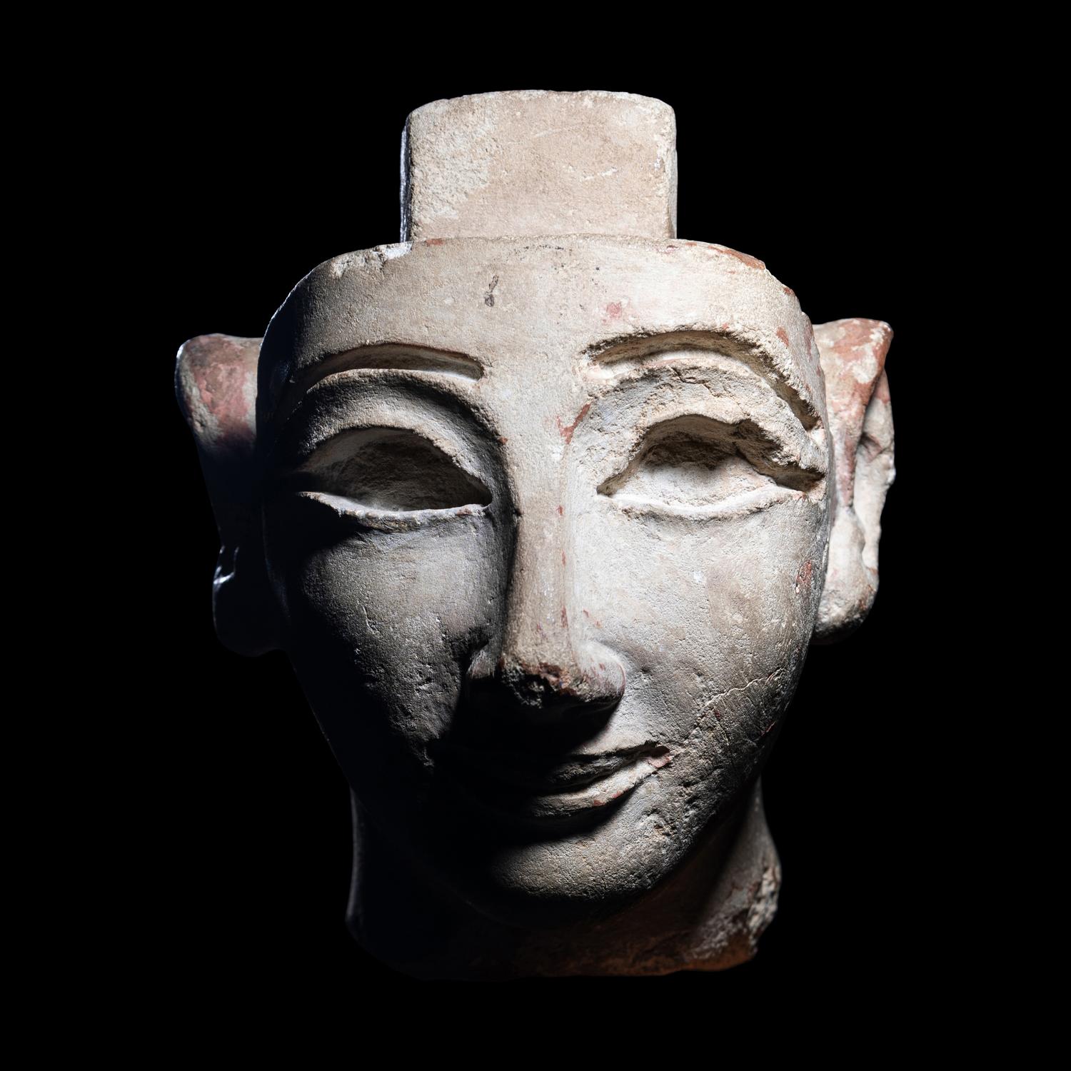 An Egyptian Limestone Head from a Composite Statue
