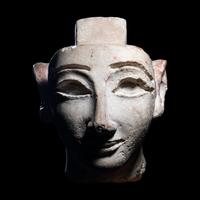 An Egyptian Limestone Head from a Composite Statue