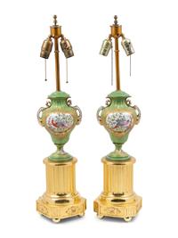 A Pair of Sèvres Style Porcelain and Giltwood Urns Mounted as Lamps