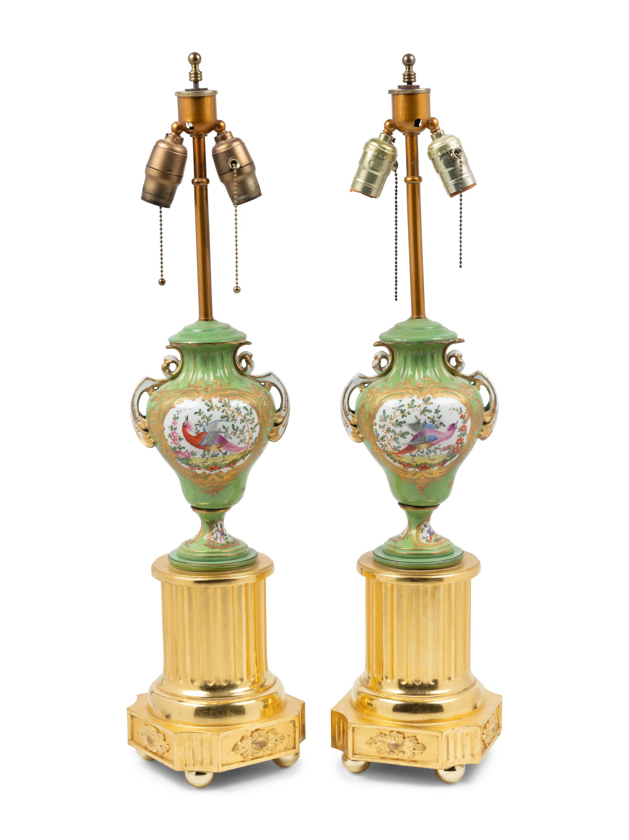 A Pair of Sèvres Style Porcelain and Giltwood Urns Mounted as Lamps