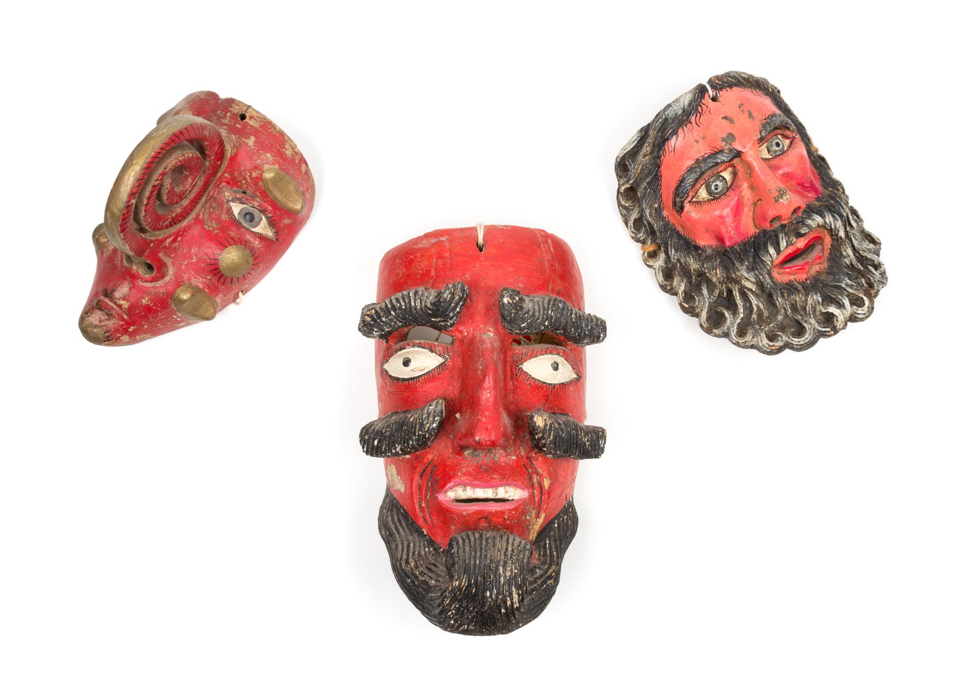 Three Central American Painted Wood Dance Masks Height 9 inches.