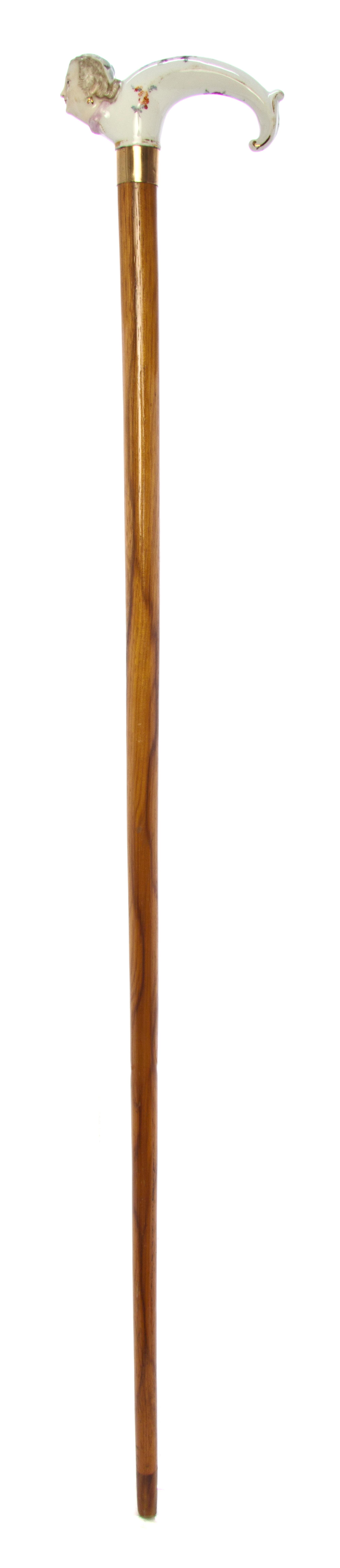 A German Meissen Style Porcelain Handled Cane, Length of handle 4 1/4 x length overall 33 3/4 inches.