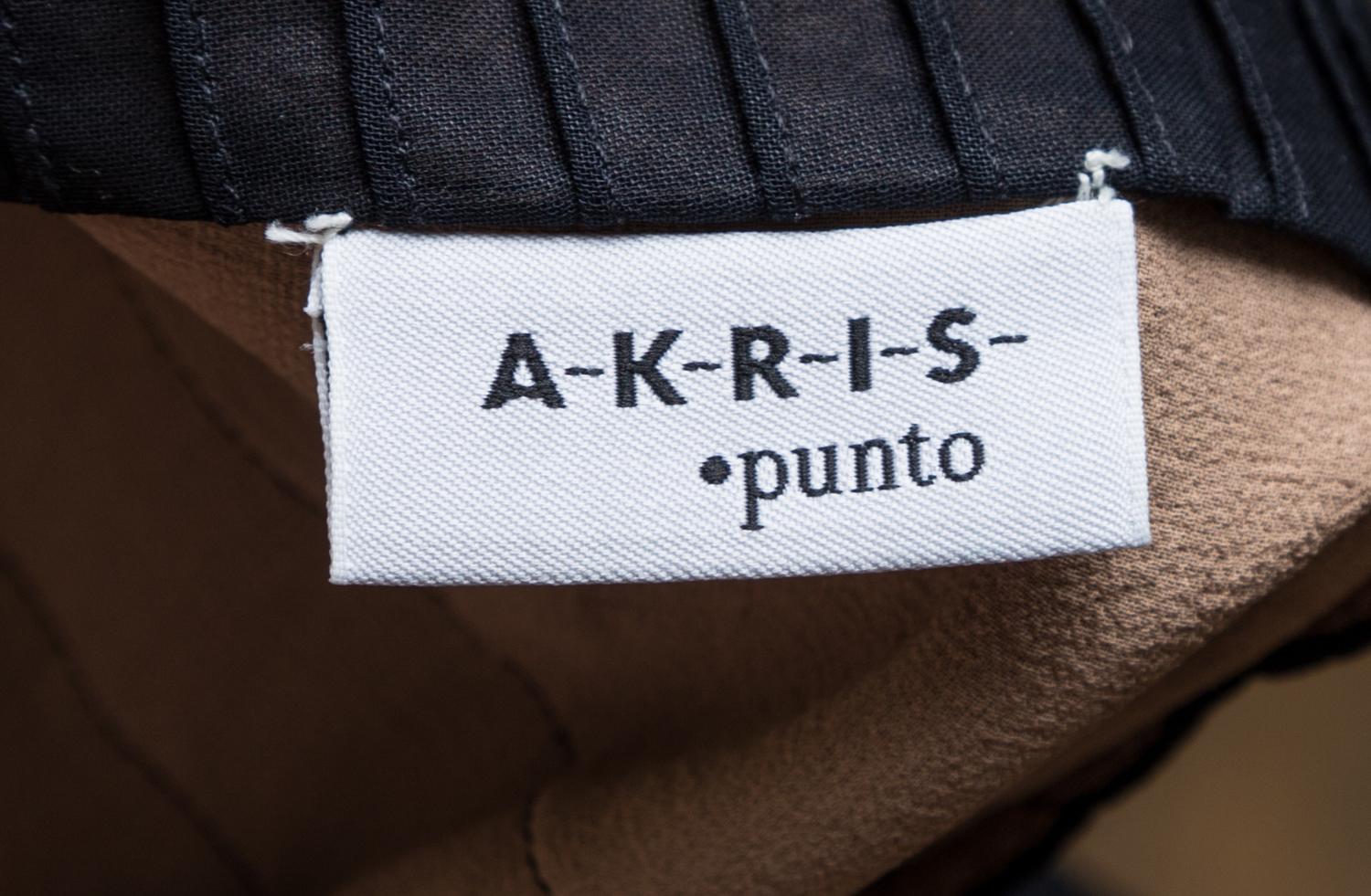 An Akris Punto Black Cotton Pleated Skirt Ensemble, Size 4.