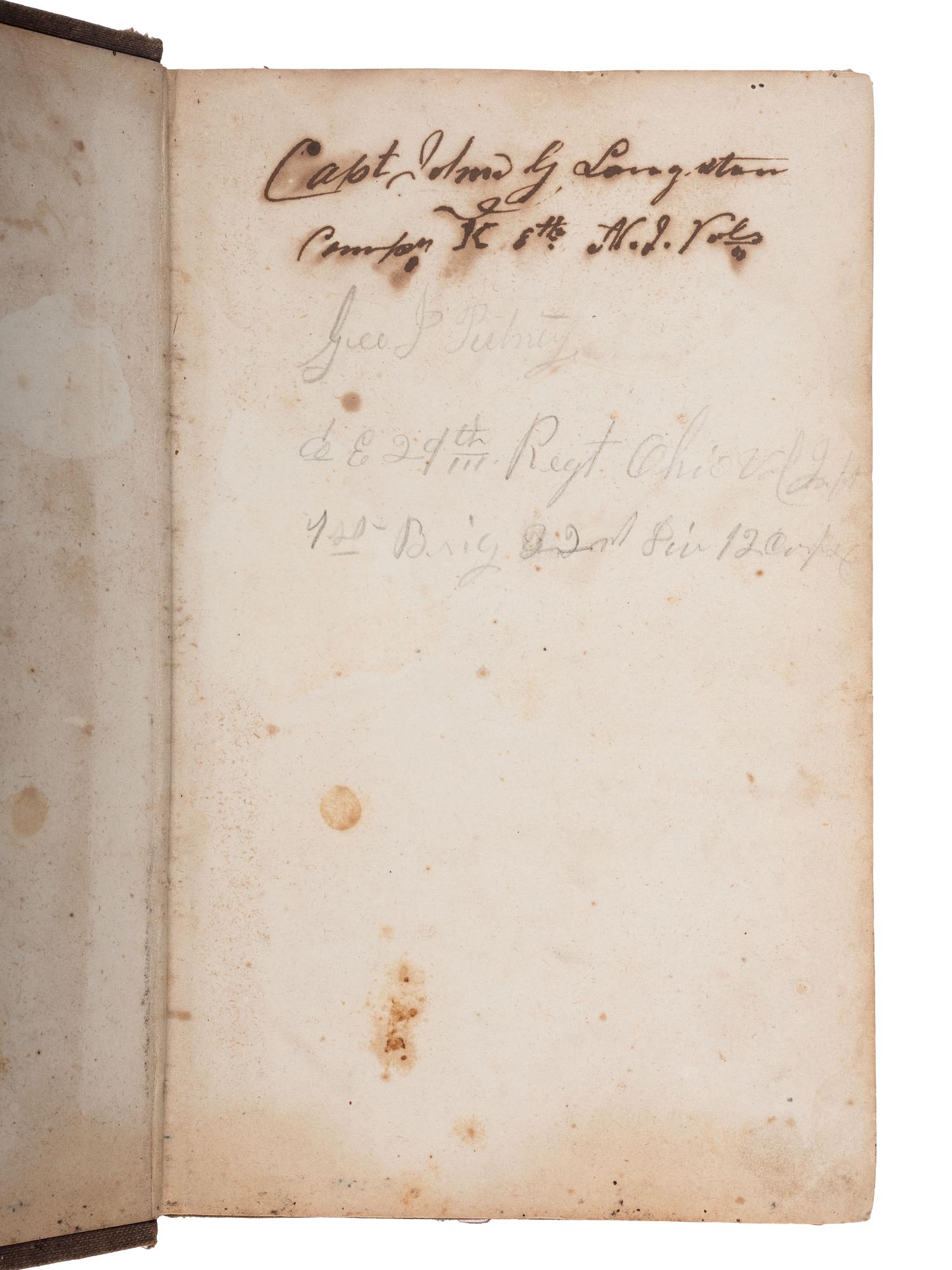[CIVIL WAR]. A group of 3 items identified to George J. Putney, Company E, 29th Ohio Infantry, comprised of a silver corps badge engraved with battle honors, embellished canteen, and book taken from wreckage at Bristoe Station.