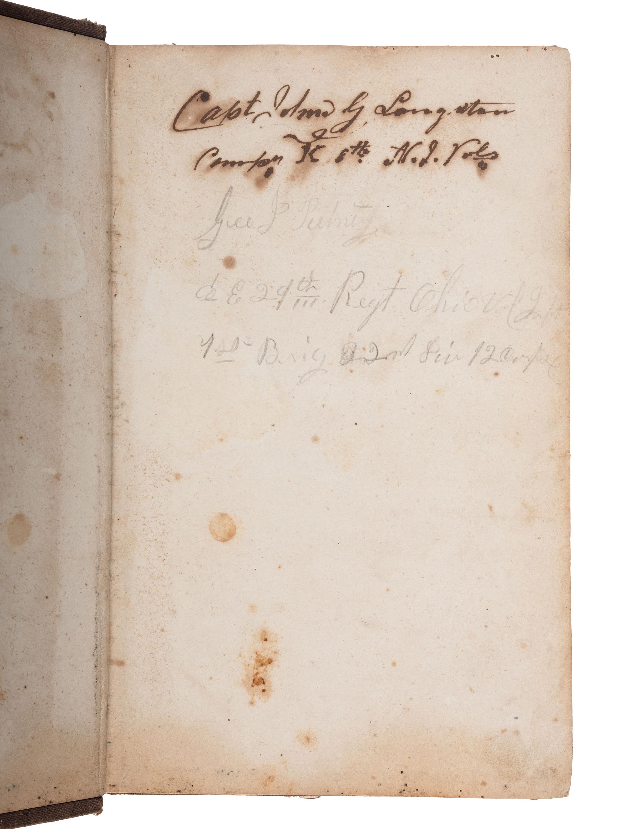 [CIVIL WAR]. A group of 3 items identified to George J. Putney, Company E, 29th Ohio Infantry, comprised of a silver corps badge engraved with battle honors, embellished canteen, and book taken from wreckage at Bristoe Station.
