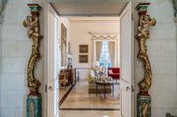 A Pair of Venetian Painted and Parcel Gilt Columns with Putti