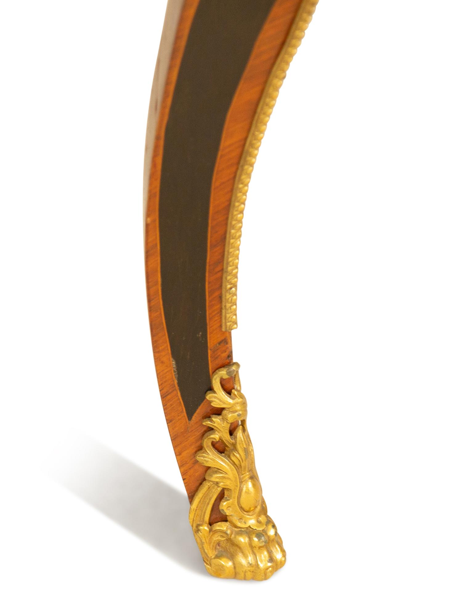 A Napoleon III Style Gilt Bronze Mounted Marquetry Center Table