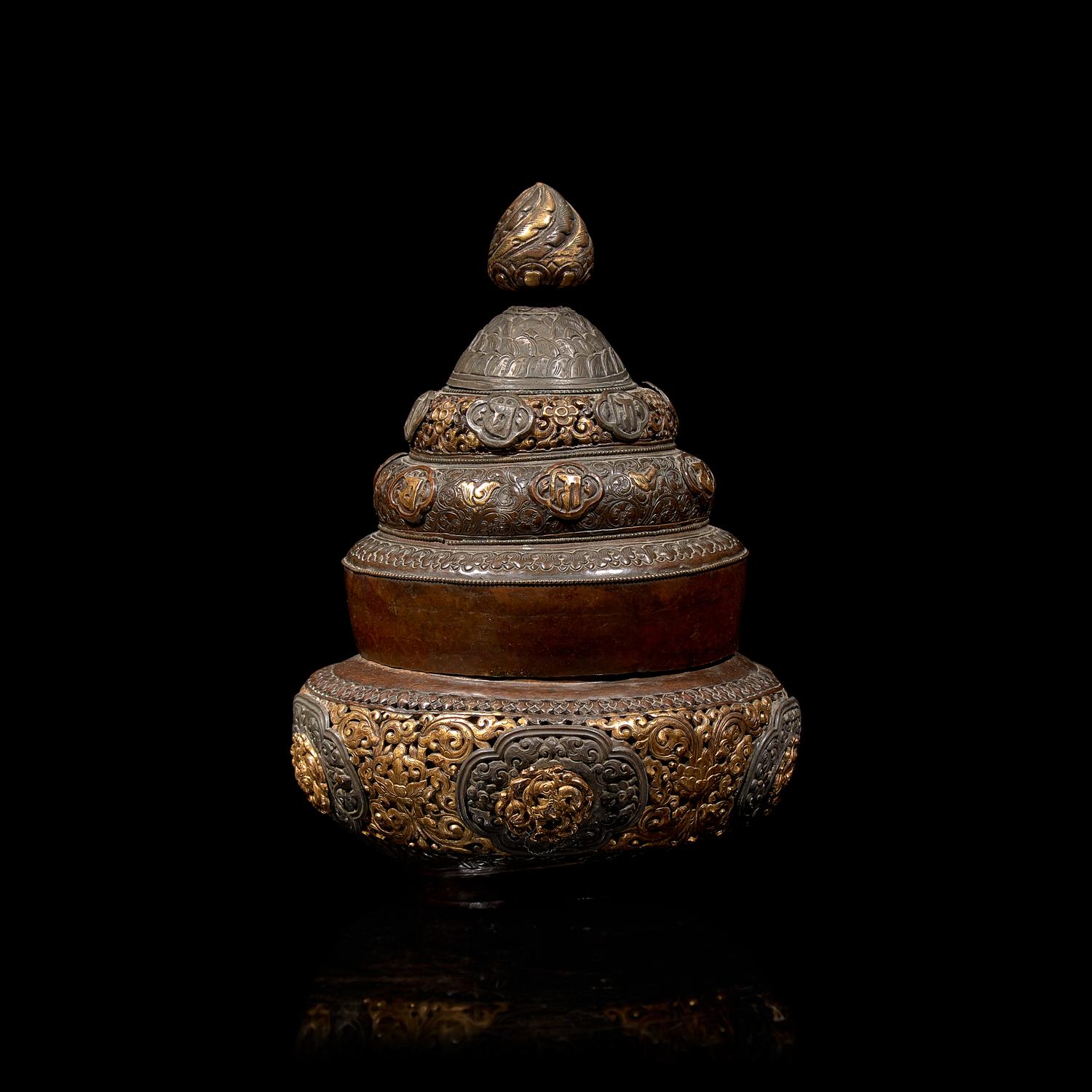A Tibetan Silver Mounted and Parcel Gilt Copper Reticulated Censer and Cover 西藏嵌銀鎏金銅蓋爐