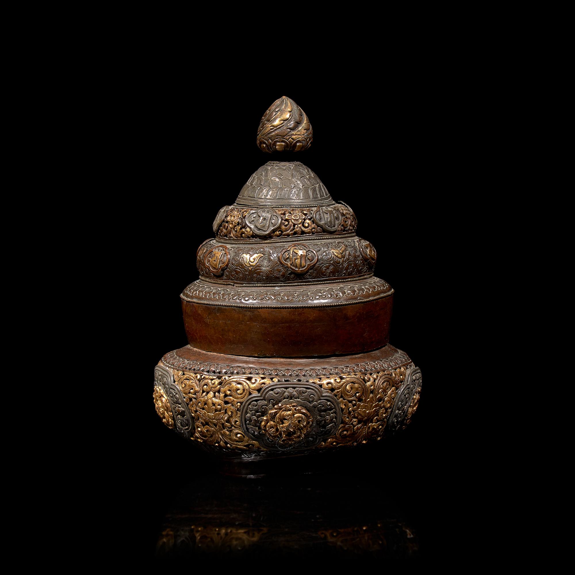 A Tibetan Silver Mounted and Parcel Gilt Copper Reticulated Censer and Cover 西藏嵌銀鎏金銅蓋爐