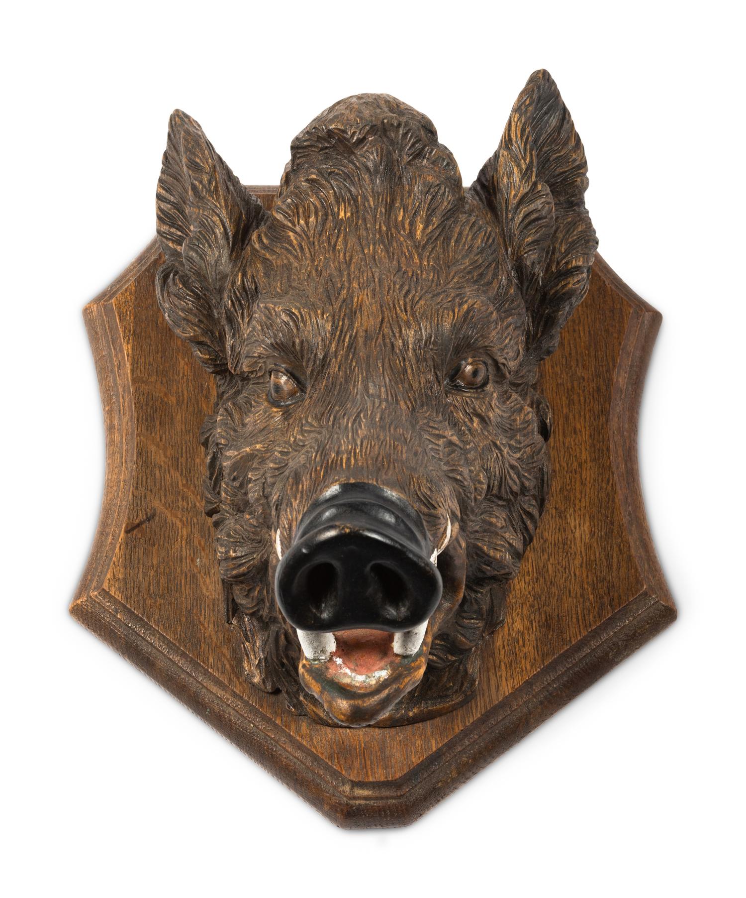 A Black Forest Carved Boar Head Mount