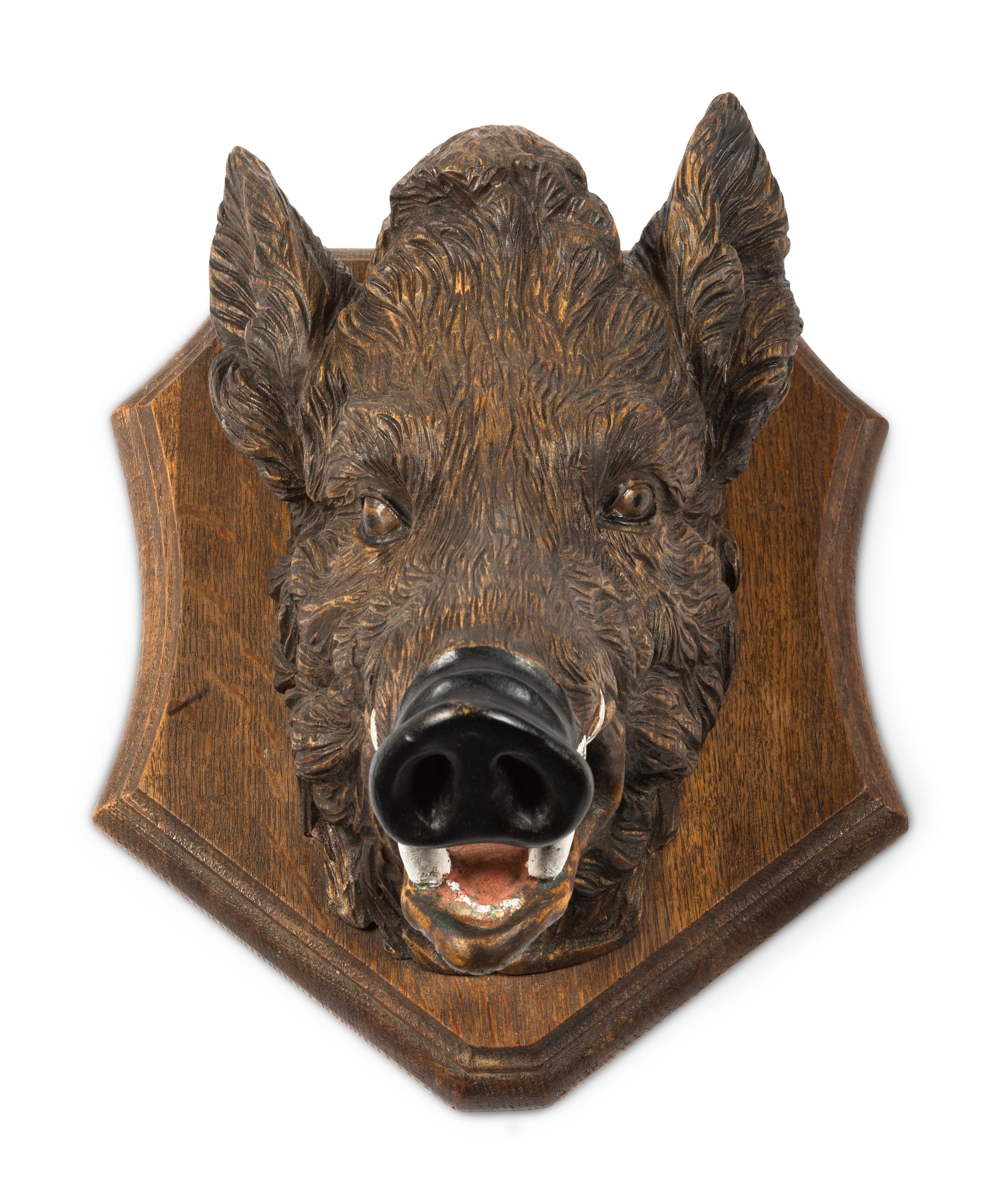A Black Forest Carved Boar Head Mount