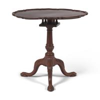 A Chippendale Carved Mahogany Tilt-Top Pie-Crust Tea Table