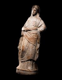 A Greek Terracotta Standing Draped Female Deity