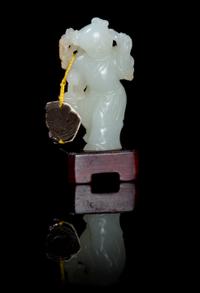 A Carved Jade Toggle Height 2 1/4 inches.