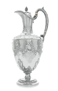 A Victorian Silver Claret Jug, Martin, Hall & Co., London, 1870, the hinged lid with a pinecone finial, the baluster form body chased w