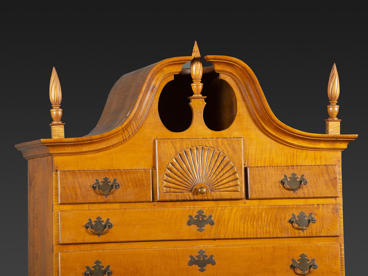 A Queen Anne Fan-Carved Tiger Maple Bonnet-Top Tablet-Foot High Chest