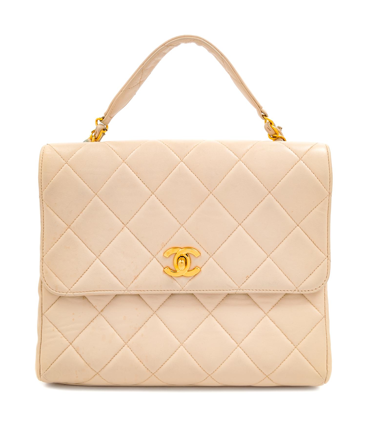 A Chanel Cream Lambskin Quilted Square Flap Bag, 8" H x 9.5" W x 3" D; Handle drop: 3".