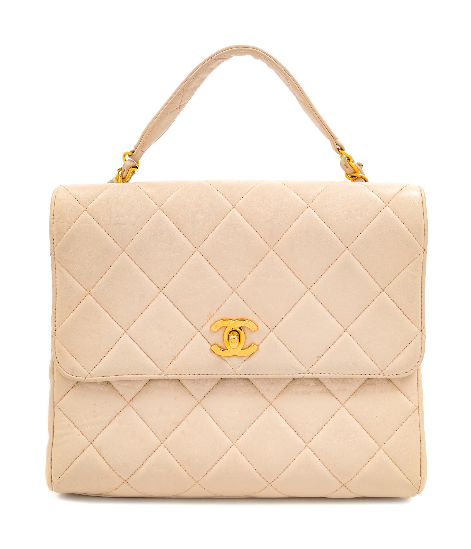 A Chanel Cream Lambskin Quilted Square Flap Bag, 8" H x 9.5" W x 3" D; Handle drop: 3".