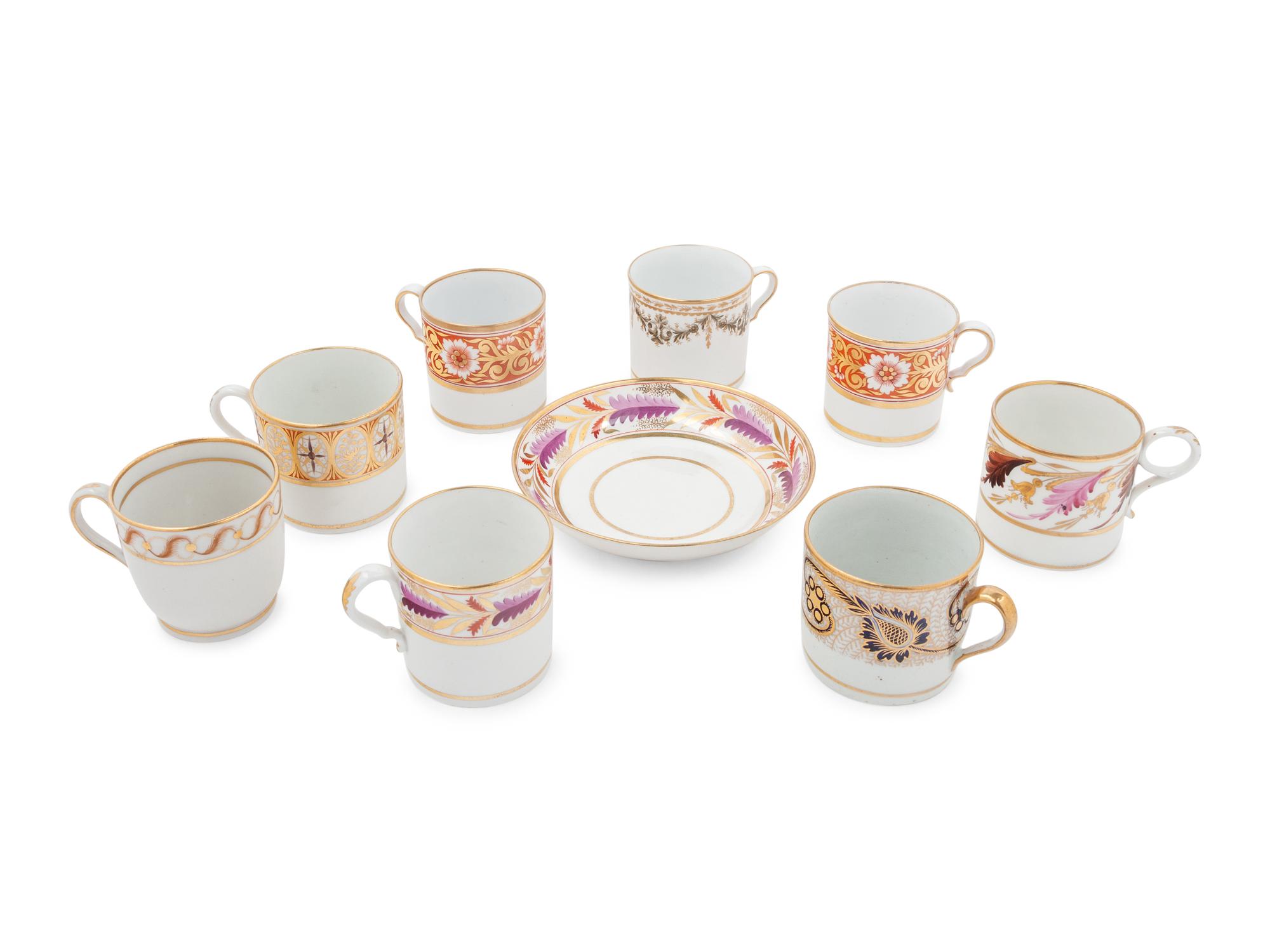 A Group of Eight English Porcelain Coffee Canns