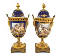 A Pair of Sevres Style Porcelain and Gilt Metal Mounted Covered Urns, Height 12 1/2 inches.