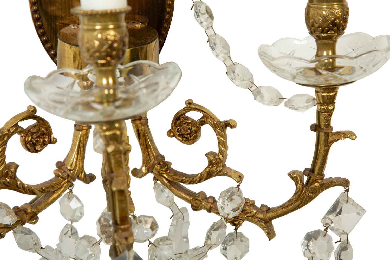 A Pair of Gilt Metal and Cut Glass Three-Light Wall Lights