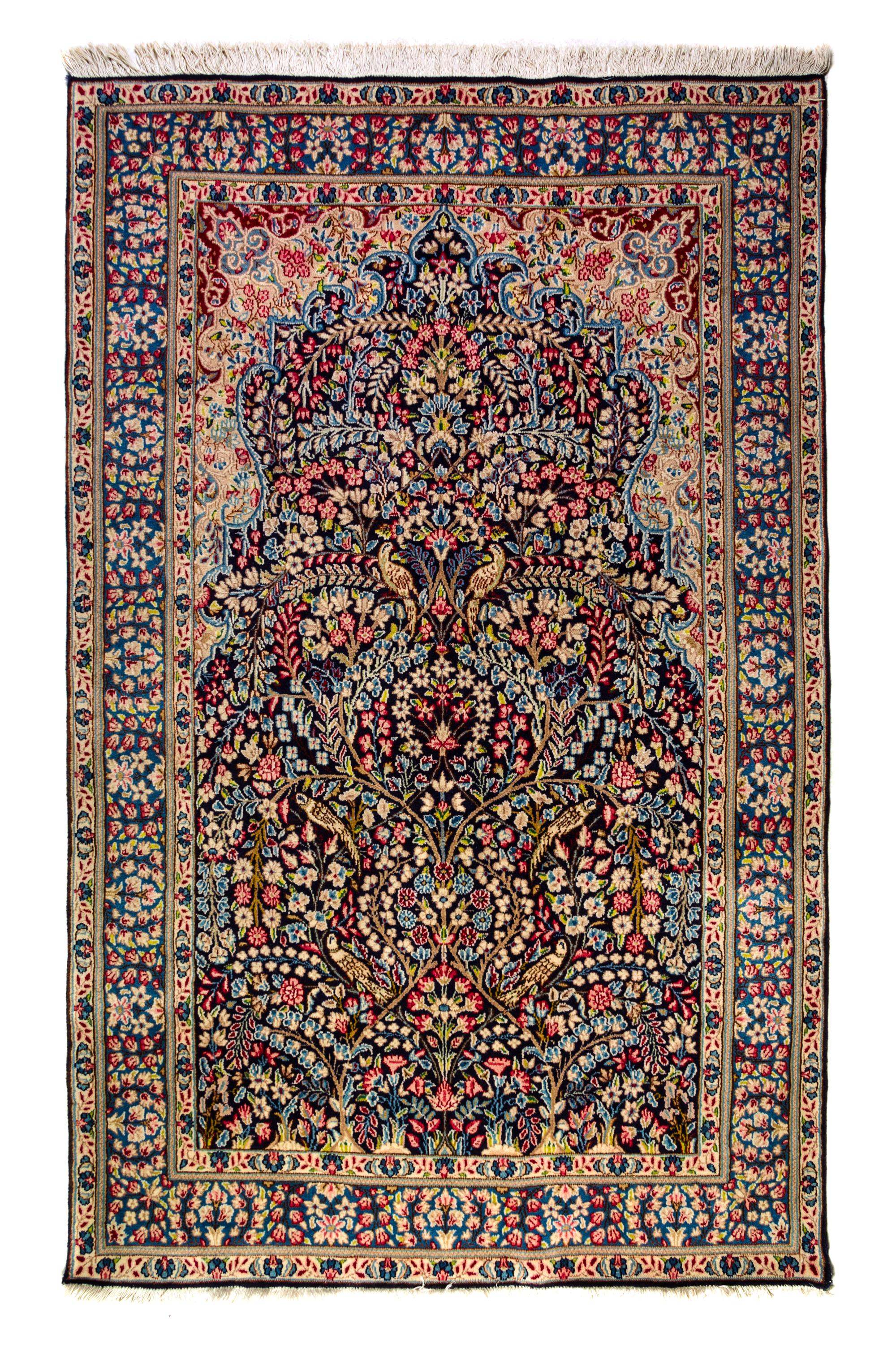 A Kirman Wool Rug 7 feet 10 inches x 4 feet 11 inches.