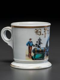 A Porcelain Occupational Shaving Mug Depicting a Steam Engine