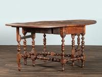 A William and Mary Figured Maple Drop Leaf Dining Table