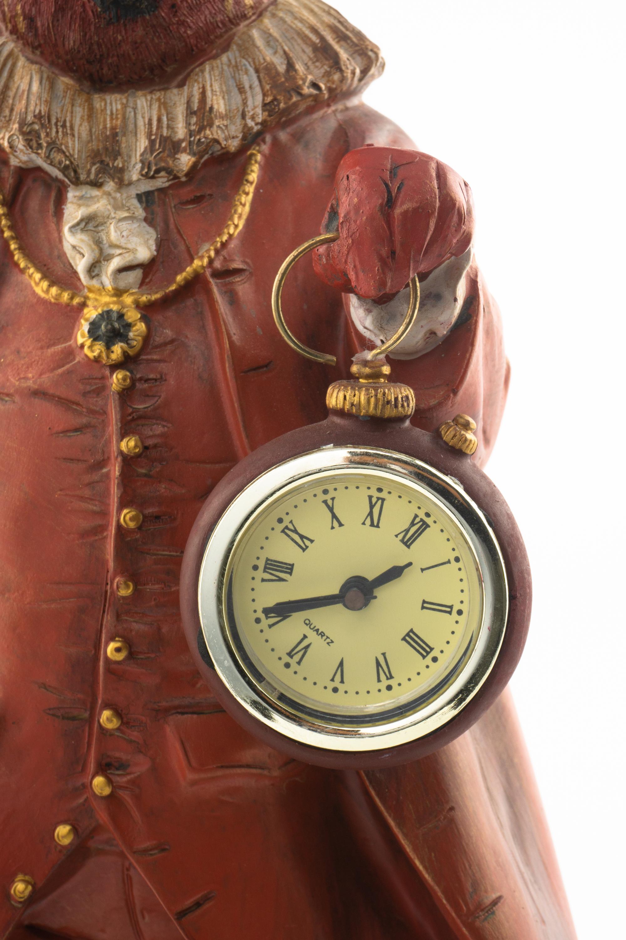 A Polychrome Resin Figural Clock