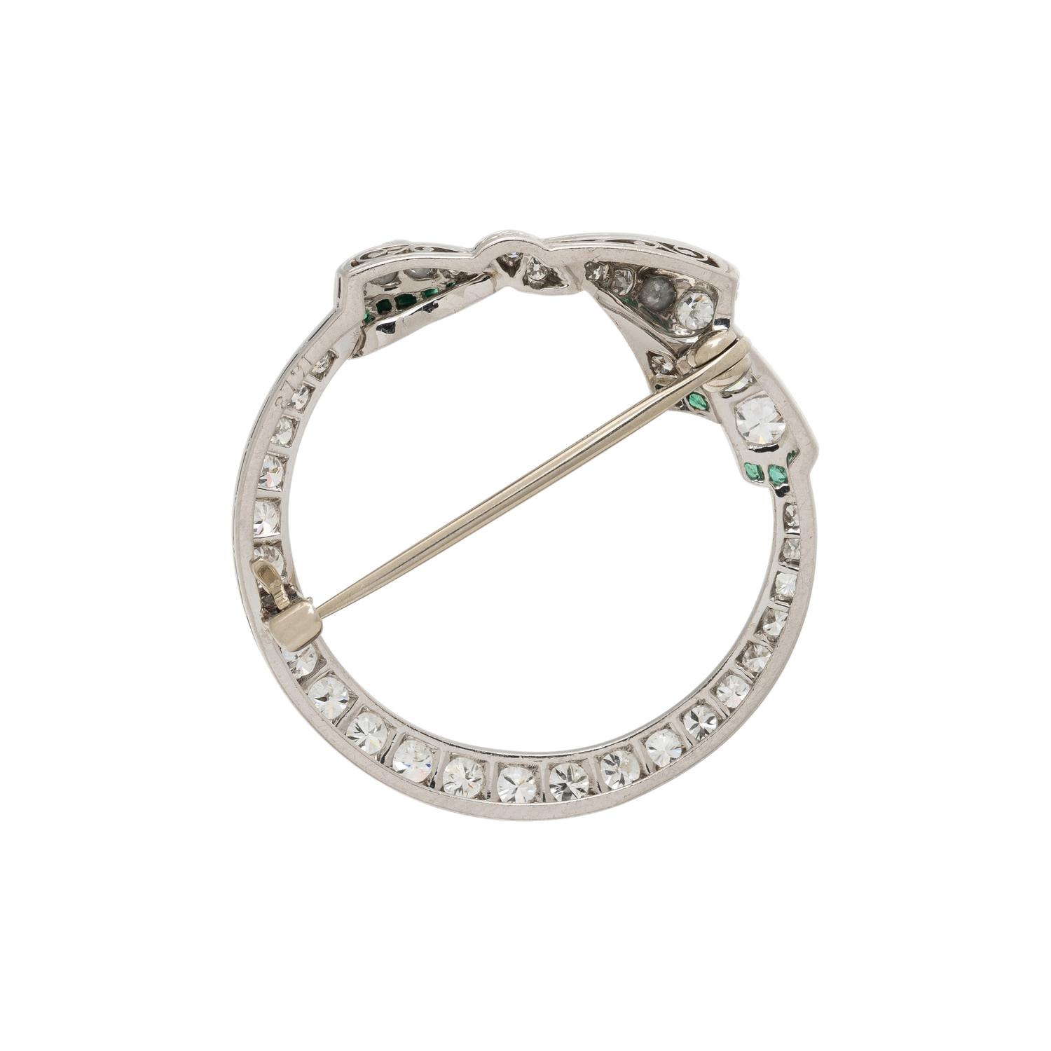 PLATINUM, DIAMOND, AND EMERALD BROOCH