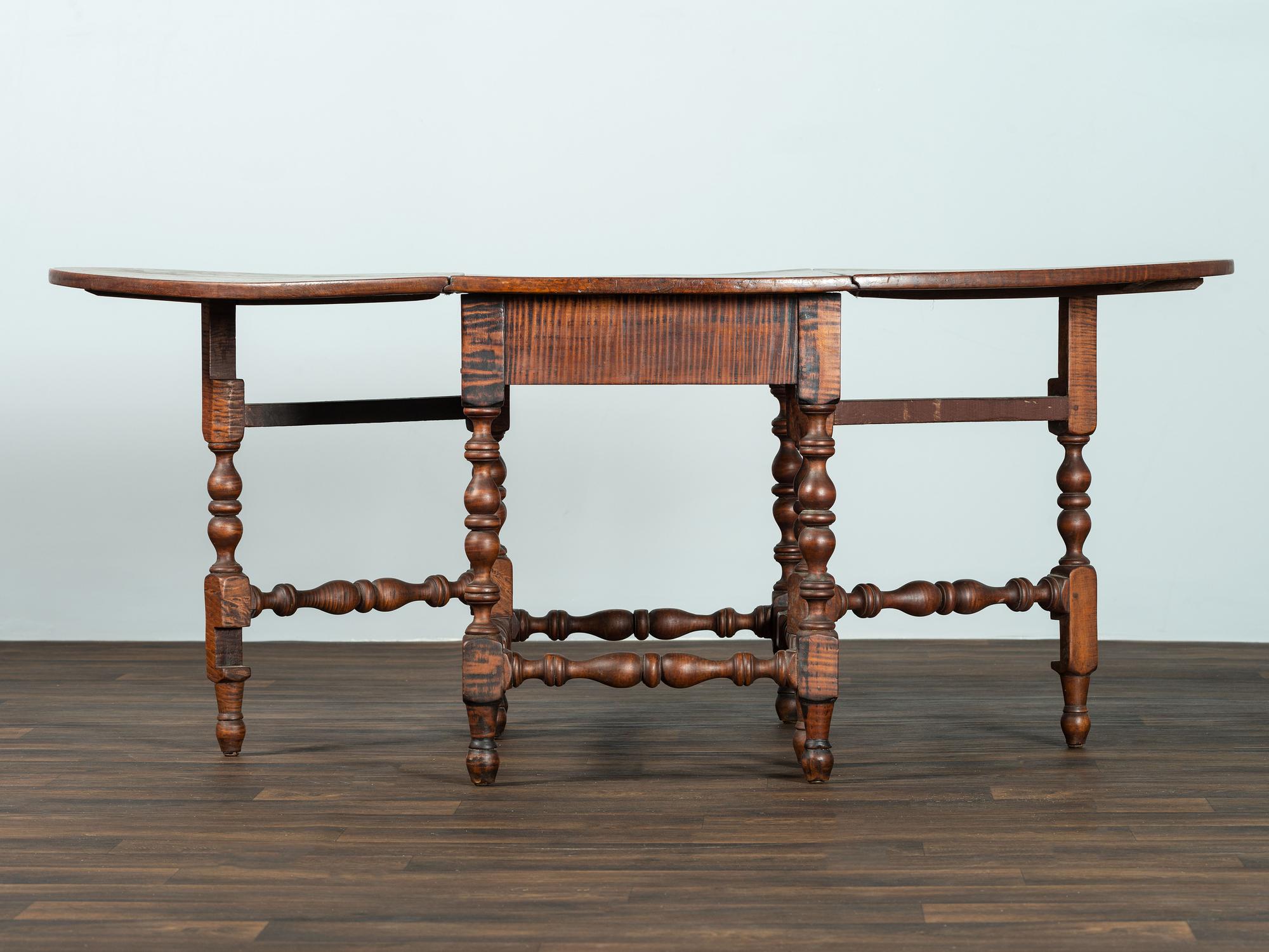 A William and Mary Figured Maple Drop Leaf Dining Table