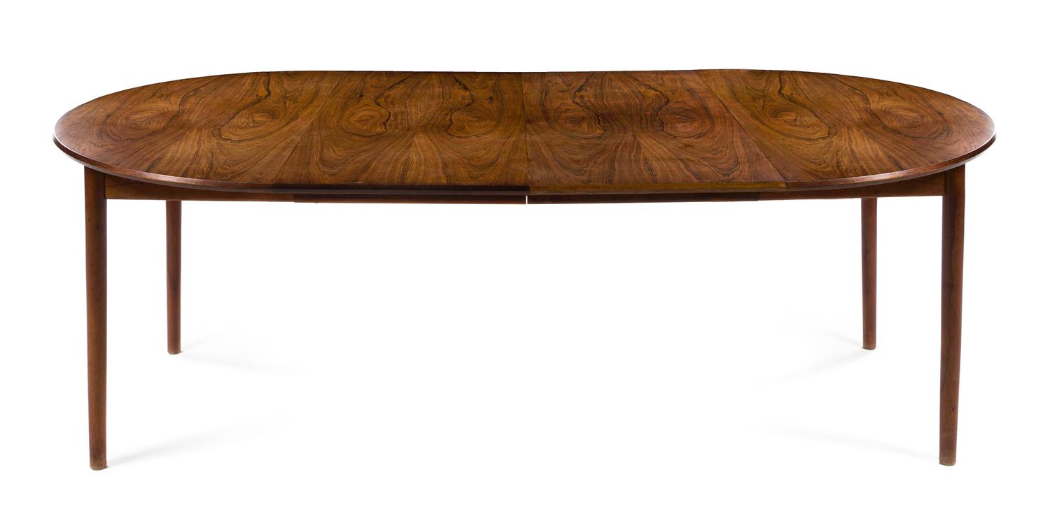 A Circular Danish Teak Dining Table, with three leaves — 1960s