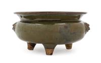 A Chinese Yaozhou Persimmon Glazed Porcelain Tripod Censer MING DYNASTY OR EARLIER Diameter 9 1/2 inches. — MING DYNASTY OR EARLIER