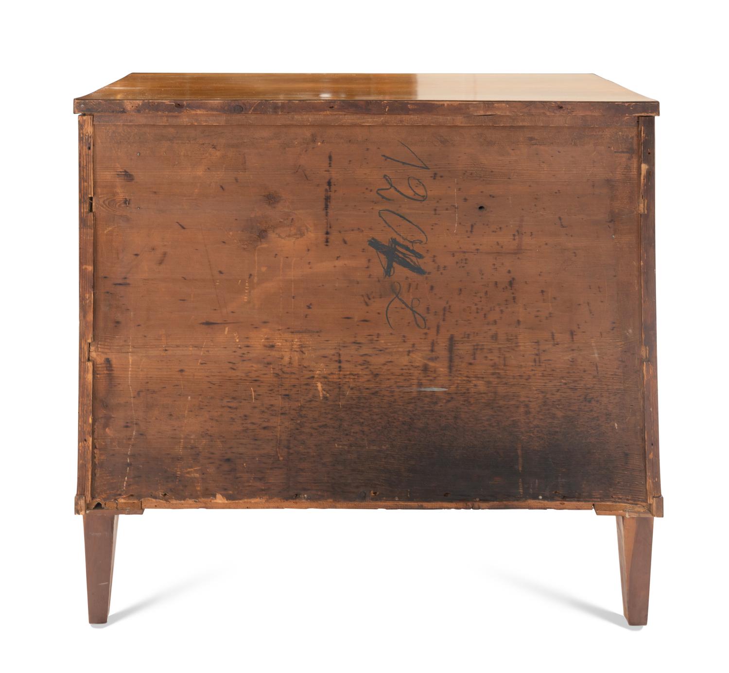 A Biedermeier Walnut and Parcel Ebonized Commode